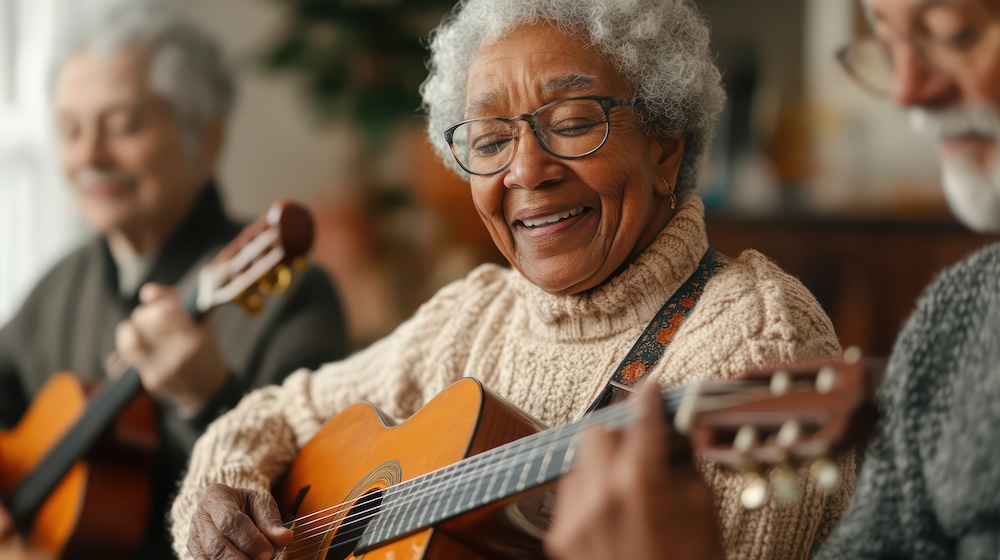 Older adults playing music together, with instruments in hand, capturing the joy of creativity and collaboration in a shared living environment.